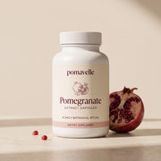 Pomavelle pomegranate extract capsule bottle and cut pomegranate